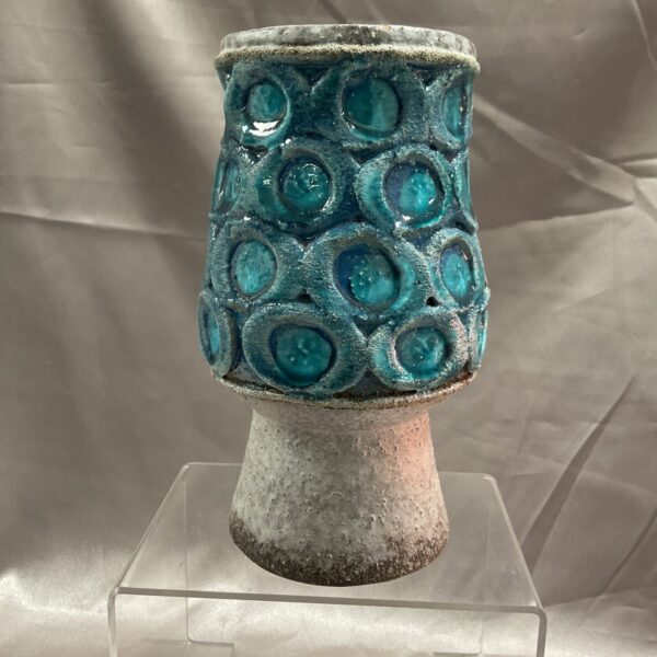 Vintage blue studio pottery vase with textured glaze.