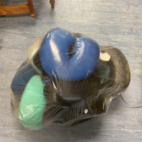 Large sack of colourful travel cushions, a vintage collection.