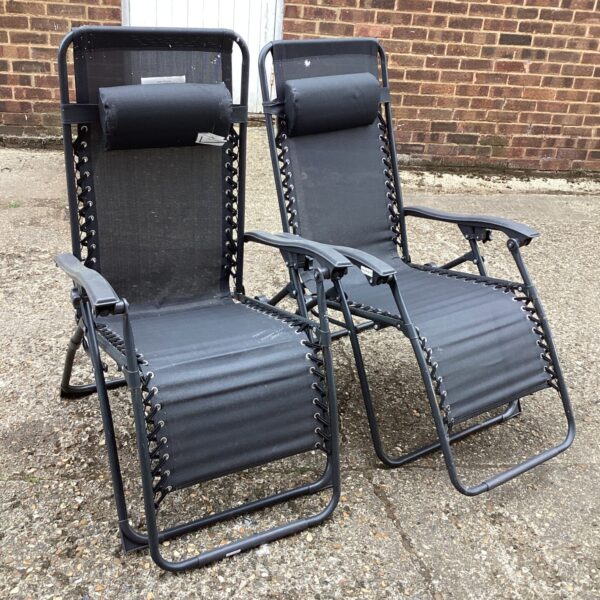 Pair of garden reclining chairs for outdoor relaxation.