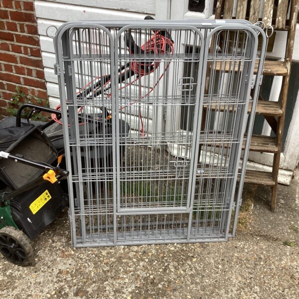 Portable garden animal cage made of wire mesh.