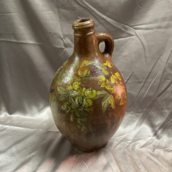 Antique 18th-century German Bellarmine flagon with foliage decoration.