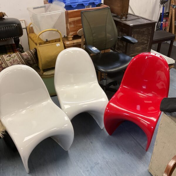 Lot of three vintage designer plastic stacking chairs.