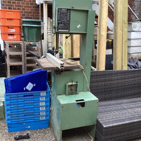 Vintage Startrite band saw in a workshop setting.