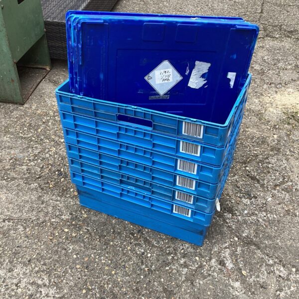Stack of six blue plastic storage crates for utility and organisation.