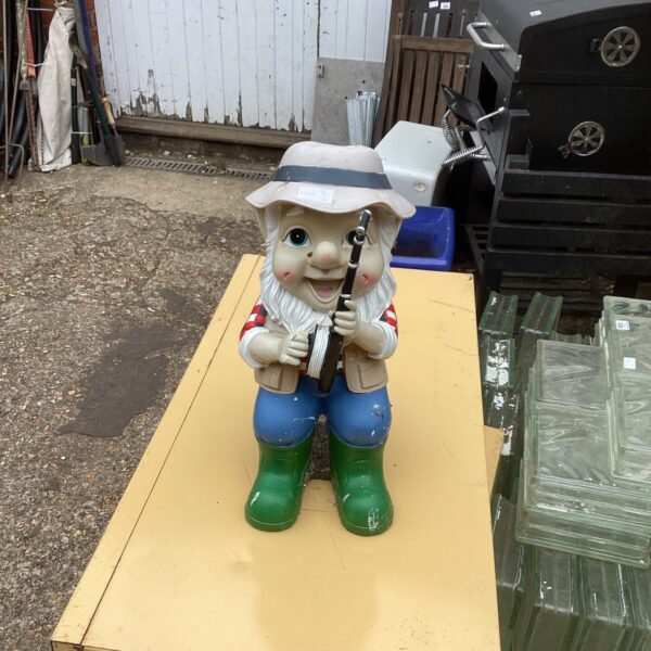 Colourful fishing gnome ornament for garden decoration.