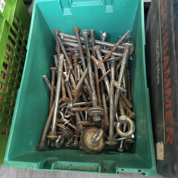 Mixed lot of large bolts and metal hardware pieces.