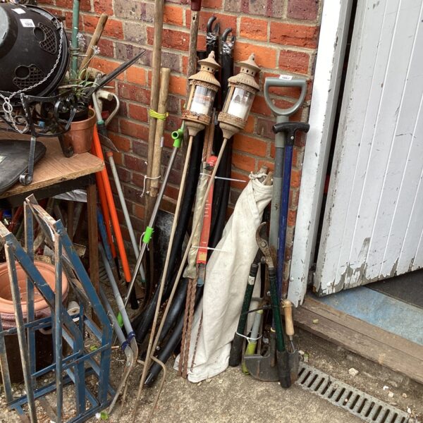 Mixed lot of rusty vintage garden tools and equipment.