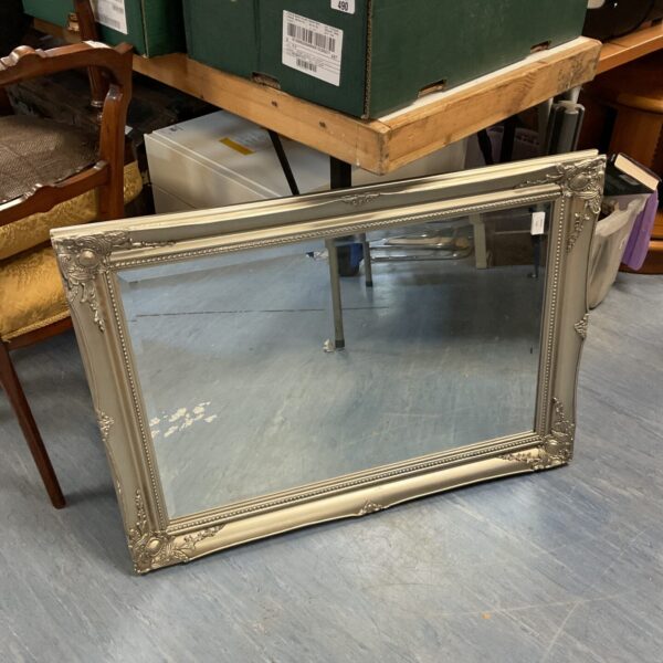 Antique silver framed mirror with bevelled edge, 90cm x 66cm.