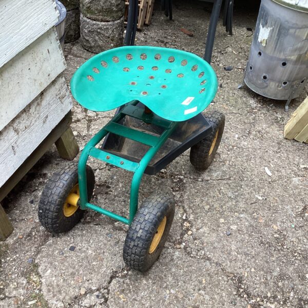 Garden weeding trolley with padded seat and wheels.
