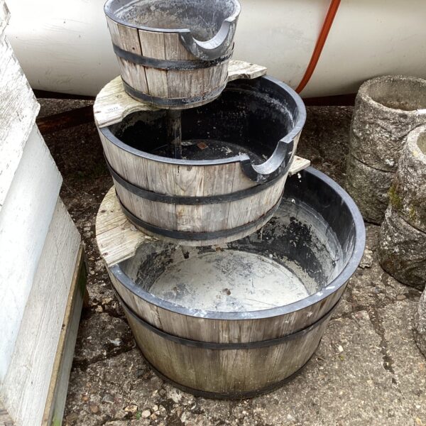 Rustic tiered garden water feature for outdoor decoration.