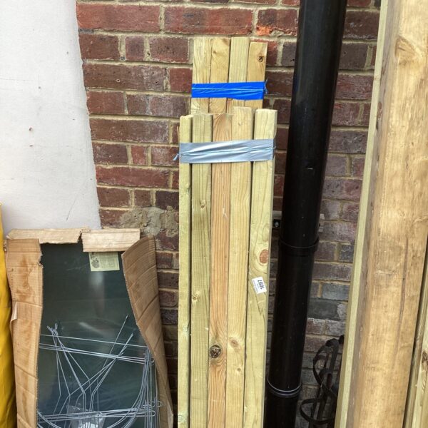Three bundles of 4ft timber lumber for DIY projects.