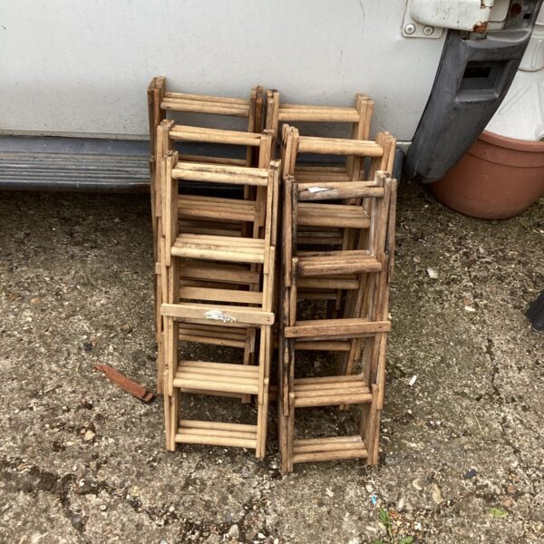 Lot of six wooden wine racks for wine storage.