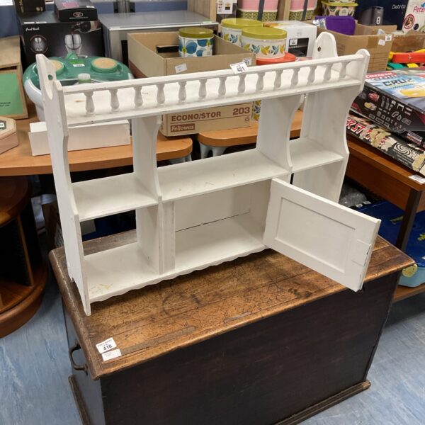 White wall shelf with decorative front edge, ideal for storage.