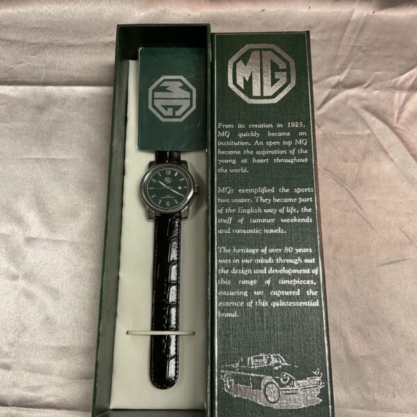 MG Owners Digital Wristwatch with black strap and logo.