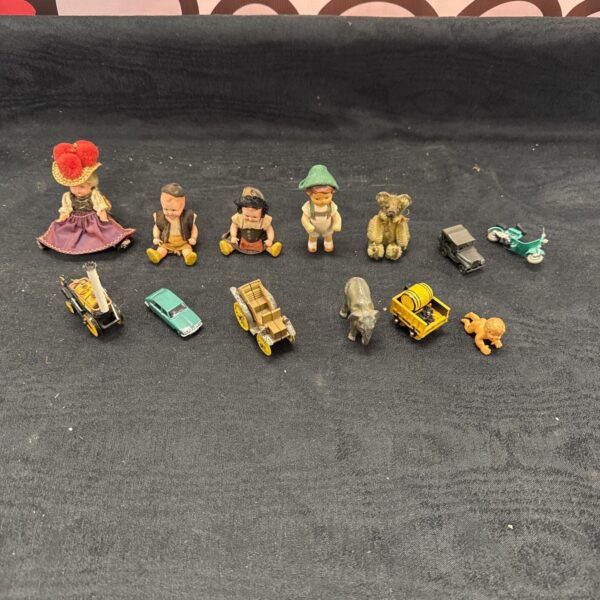 Vintage lot of miniature dolls and toys, including German composition dolls.