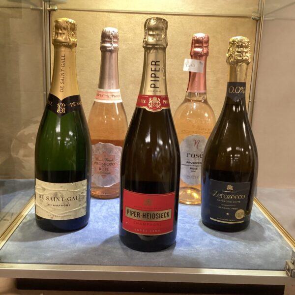 Assortment of champagne and wine bottles in a collection.