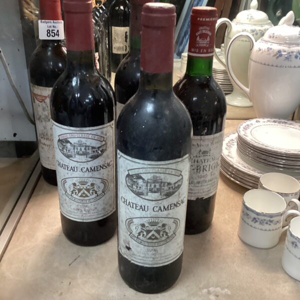 Four bottles of Chateau Camensac wine in a collection.