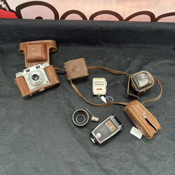 Vintage Agfa Silette camera with case and strap for collectors.