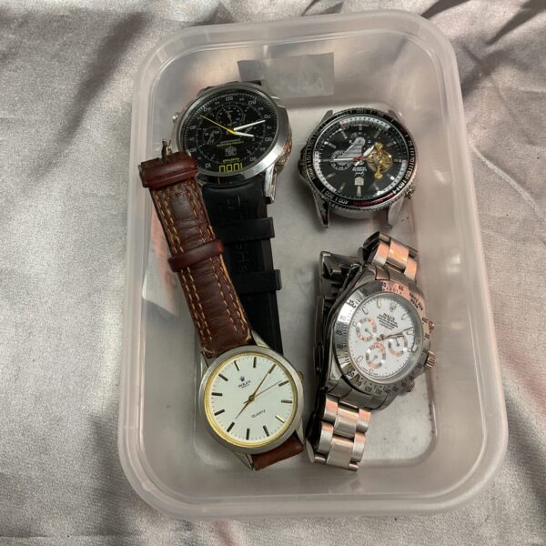 Tray of four vintage digital wristwatches, a collectible lot.