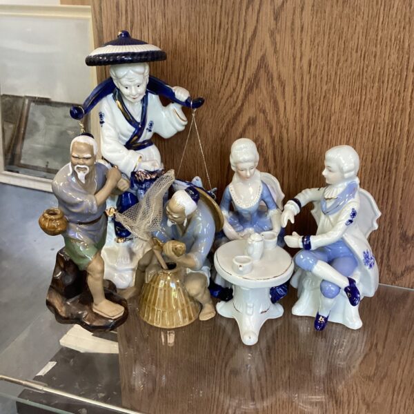 Vintage porcelain figurines set of three Asian collectibles.