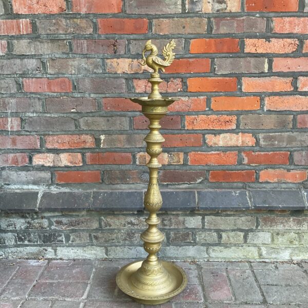 Vintage brass floor ashtray with elegant phoenix finial.