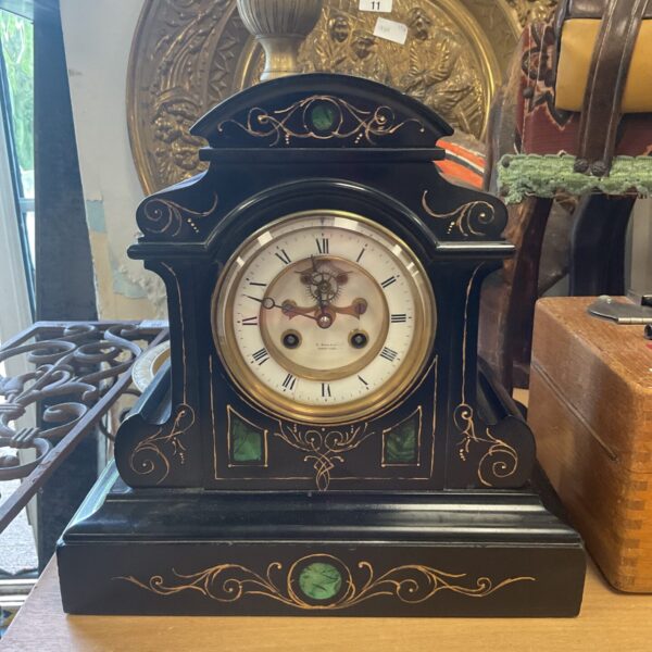 Antique Meck E Dowell Hastings clock with carved wooden case.