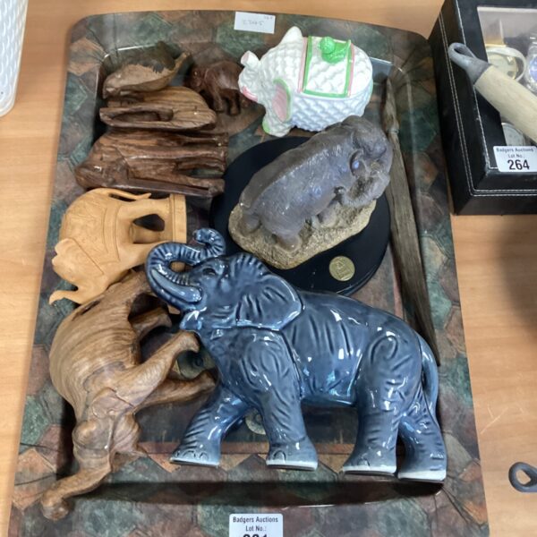 Vintage ceramic elephant figurines in a collectible lot, showcasing unique animal designs.