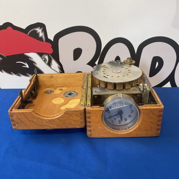Antique Benzing pigeon racing clock with wooden case.
