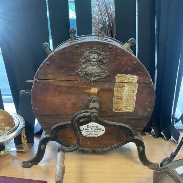 Antique Kent knife cleaning machine with embossed lettering.