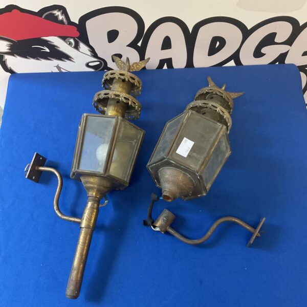 Pair of vintage brass lamps with eagle finials.