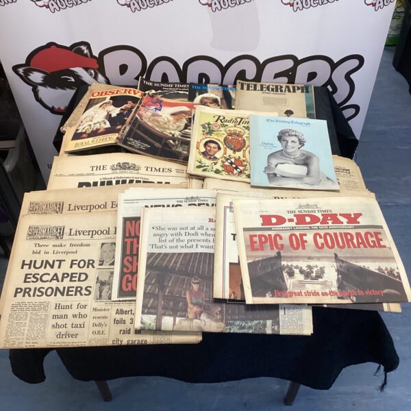 Vintage newspapers and magazines covering historical events.