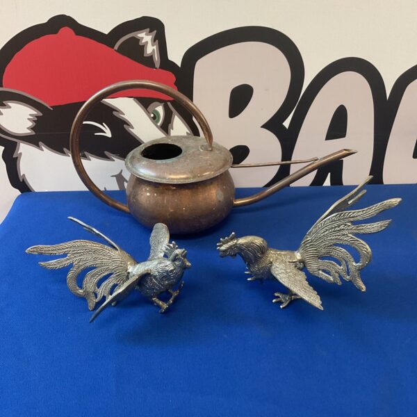 Vintage silver plate fighting cocks and copper watering can.