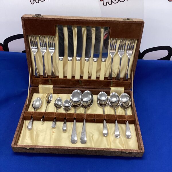 Vintage stainless steel canteen with cutlery set inside.