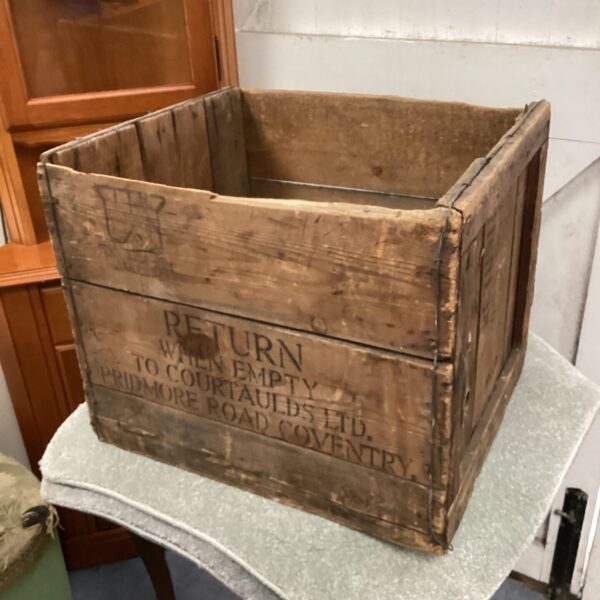 Antique wooden rayon box with visible wear and tear.