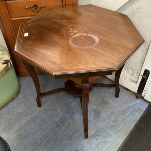 Antique Regency octagonal mahogany table with inlaid details.