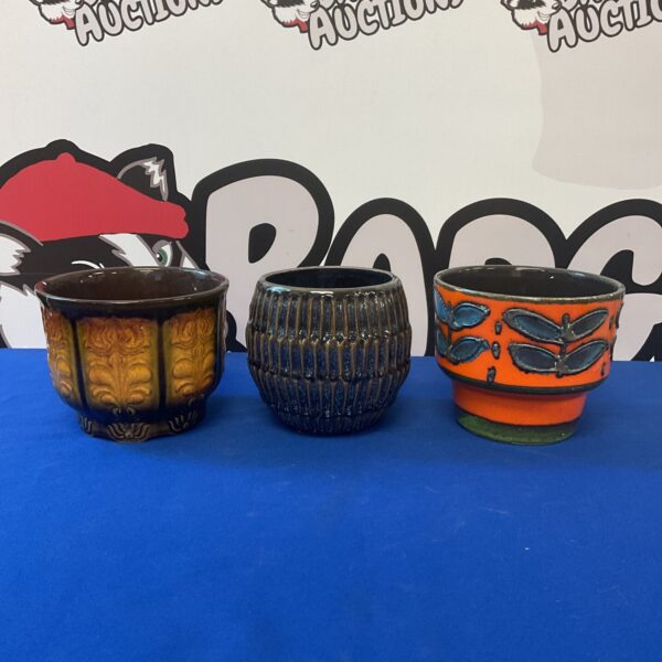 Vintage lot of three ceramic plant pots with unique glazes.