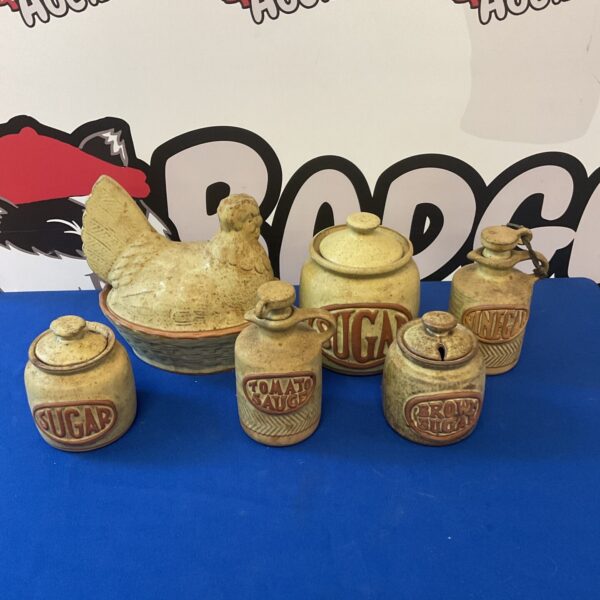 Vintage Cornish stoneware pottery collection with chicken figurine.