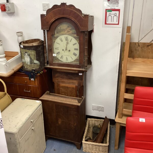 Antique grandfather clock with a greyhound hunting scene.