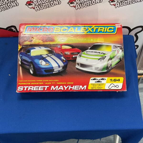 Vintage Scalextric Street Mayhem track set with two cars.
