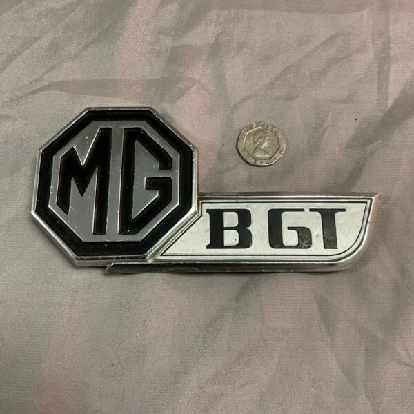 Vintage MG BGT boot badge with octagonal logo.