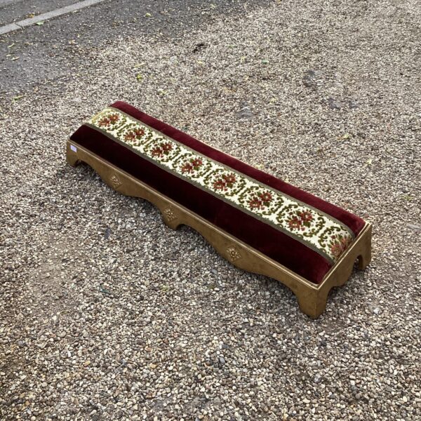 Victorian log footstool with detailed floral embroidery.