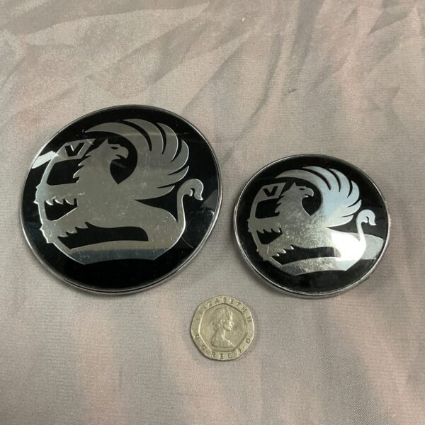 Vintage Vauxhall car badges with griffin crest emblem.