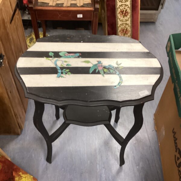 Antique painted hall table with decorative detailing.