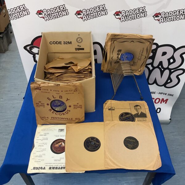 Vintage gramophone records and wooden rack for collectors.