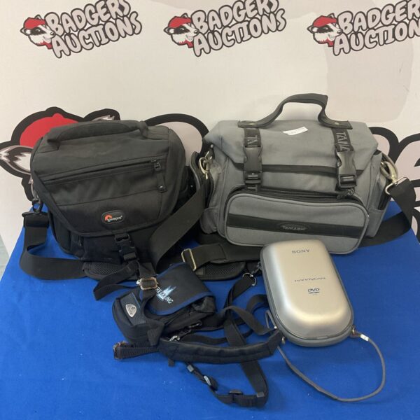 Lot of four camera bags for photography equipment.