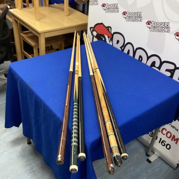 Lot of six snooker and pool cues including a BCE cue.