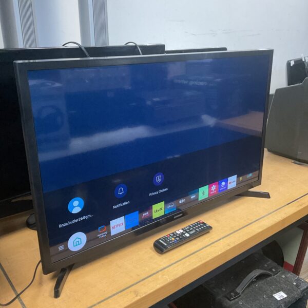 Samsung 32 inch smart TV displaying the home screen.