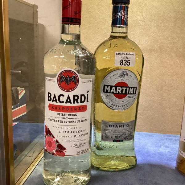 Vintage Bacardi and Martini bottles, collectible spirits display.