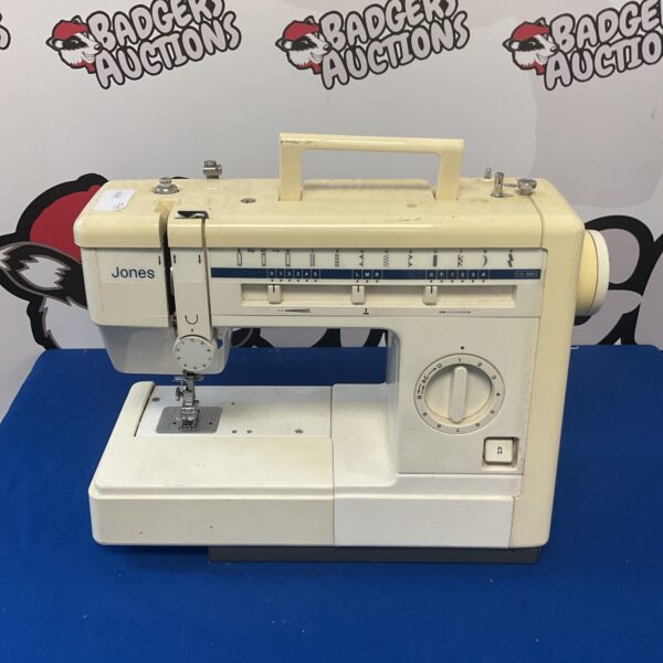 Vintage Jones electric sewing machine in used condition.