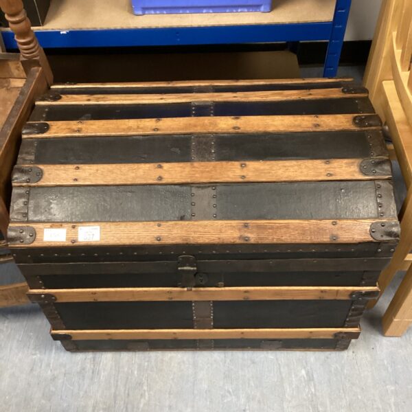 Vintage Hart & Company travel trunk with domed top and metal banding.